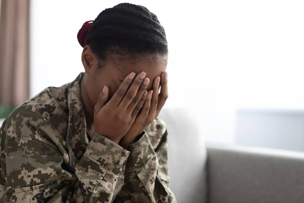 Depression Concept. Upset African American Soldier Lady Covering Face With Hands - Photo, Image