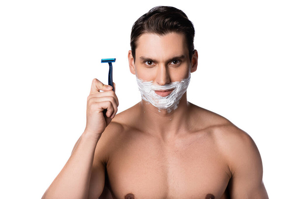 smiling man with naked chest holding safety razor and looking at camera isolated on white - Photo, Image