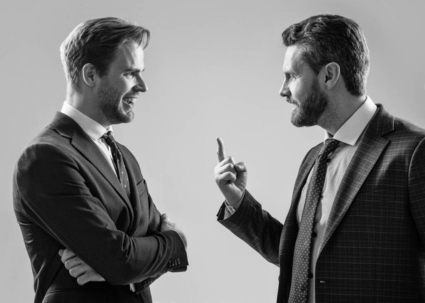two angry businessmen arguing having struggle for leadership, misunderstanding. - Photo, Image