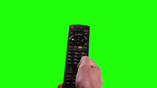 Ruční držení TV dálkové ovládání Izolované na zelené obrazovce Chroma Key. Zavři. Zelenou obrazovku můžete nahradit záběrem nebo obrázkem, který chcete. Můžete to udělat s klíčovým efektem v After Effects nebo s jiným softwarem pro editaci videa. - Záběry, video