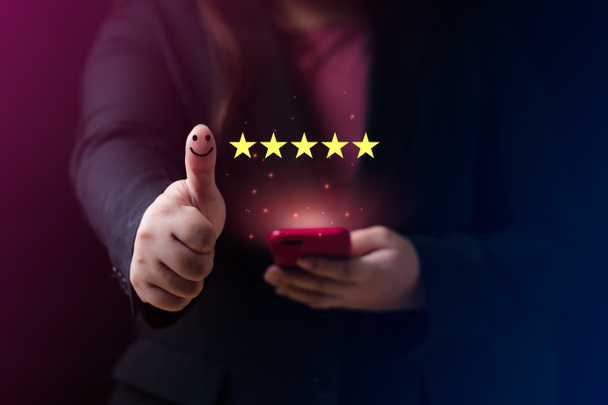 Customer satisfaction concept. Hand with thumb up Positive emotion smiley face icon and five star with copy space. 5 star satisfaction, Excellent business rating experience - Fotografie, Obrázek