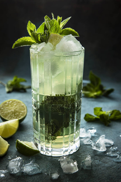Refreshing drink with  mint  leaves on dark concrete  background, selective focus - Photo, Image