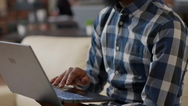 Male entrepreneur using laptop to plan financial analysis - Кадры, видео