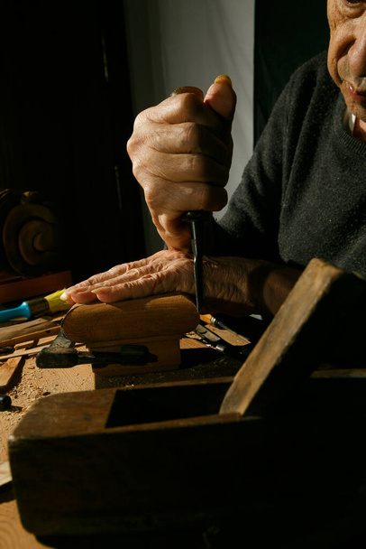 Craftsmans hands working on wood carving, with gouge and chisel Cabinetmaker, carpentry - Fotoğraf, Görsel