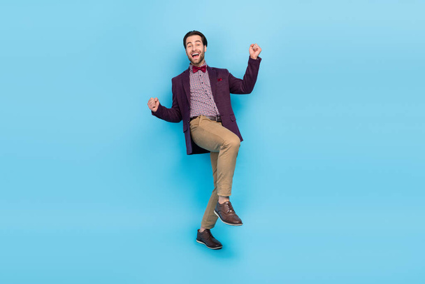 Full body photo of young excited guy rejoice awesome fists hands hooray isolated over blue color background - Foto, Bild
