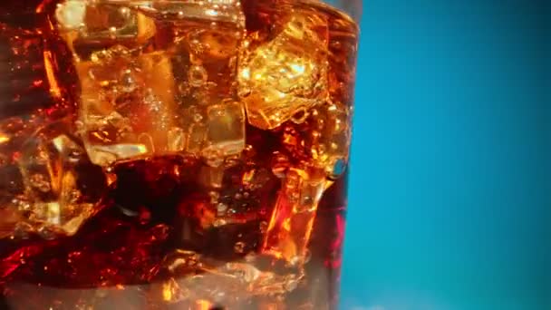 Macro shoot of cola with ice cubes. - Materiaali, video
