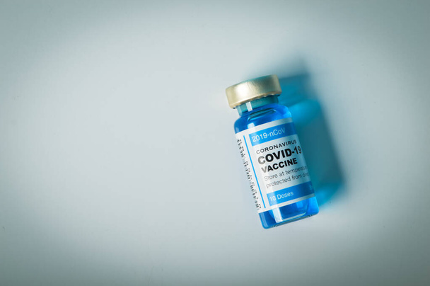 Covid-19 vaccine ampoule isolated on a white background - Valokuva, kuva