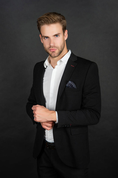 young man in suit on black background, fashion - Fotó, kép