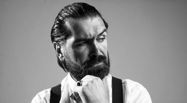 masculinity and charisma. formal party dress code. old fashioned bearded hipster. hairdresser concept. brutal handsome man with moustache. mature barber in retro style - Foto, Imagen