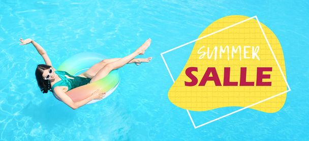Happy young woman with inflatable ring in swimming pool. Banner for summer sale - Foto, Imagen