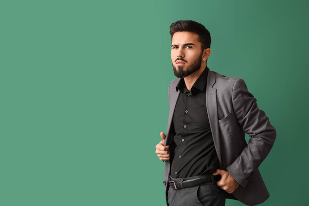 Fashionable bearded man on green background - Photo, Image