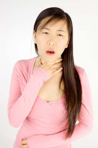 Asian woman with sore throat not able to talk - Photo, image