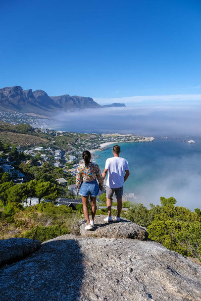 view from The Rock viewpoint in Cape Town over Campsbay, view over Camps Bay with fog over the ocean in Cape Town South Africa - Photo, Image