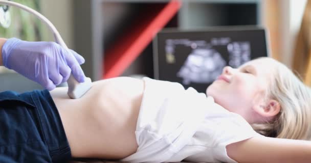 Doctor conducting ultrasound examination of internal organs of child in clinic 4k movie - 映像、動画