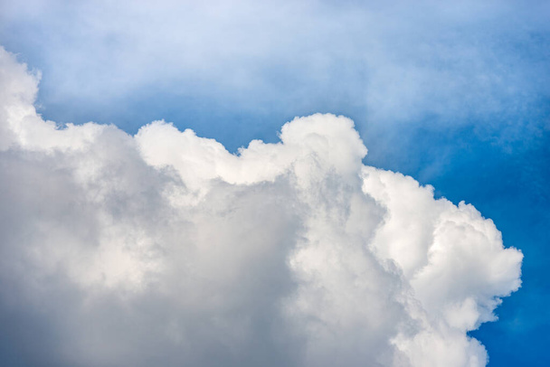 Beautiful storm clouds, cumulus clouds or cumulonimbus against a clear blue sky. Photography, full frame, sky only. - Fotoğraf, Görsel