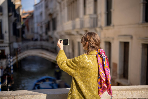 Beautiful stylish woman walking in Venice, Italy - Photo, Image