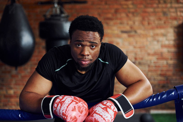 Strong african american boxer in sportive clothes have practice in the gym. - Fotó, kép