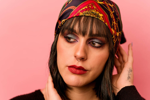 Young caucasian makeup artist woman isolated on pink background - Photo, Image