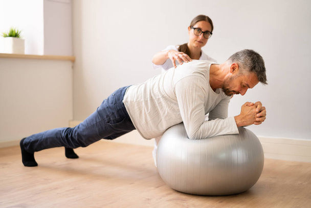 Physical Physiotherapy And Rehabilitation. Professional Therapist Exercising With Patient - Fotoğraf, Görsel