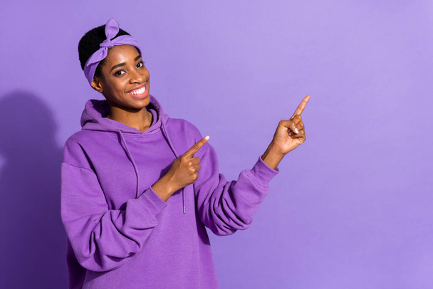 Photo of promoter transgender indicate empty space novelty wear headband sweatshirt isolated purple color background - Photo, Image