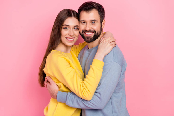 Portrait of two lovely peaceful people embrace toothy smile look camera isolated on pink color background - Foto, Imagem