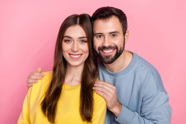 Portrait of two peaceful lovely partners embrace beaming smile look camera isolated on pink color background - Foto, immagini