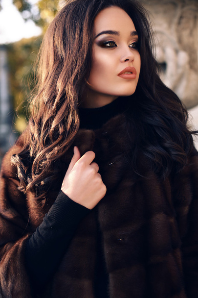 portrait of sexy beautiful woman with dark hair in luxurious fur coat - Zdjęcie, obraz