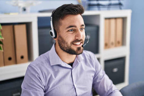 Young hispanic man call center agent working at office - Fotoğraf, Görsel