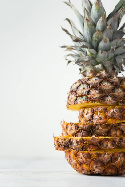 ripe pineapple cut into pieces on a white background. Close up. Juicy fruit - Photo, Image