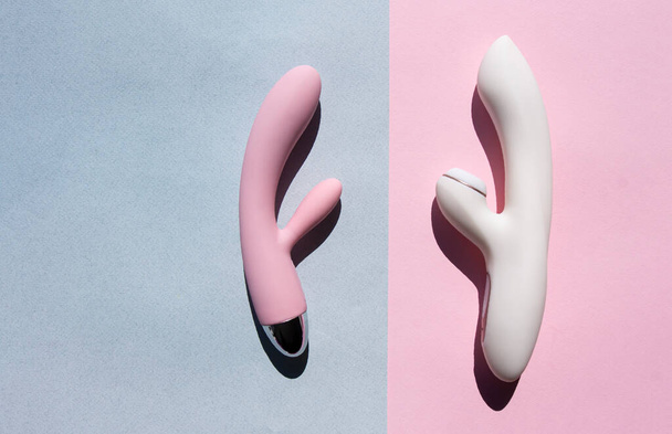 Two adult sex toys in white and pink lie on two different backgrounds - Foto, imagen