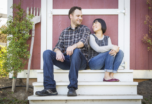 Mixed Race Couple Relaxing on the Steps - Photo, Image