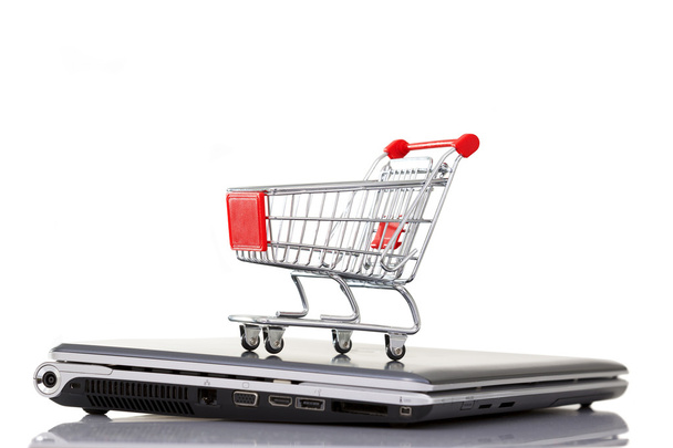Shopping cart over a laptop computer - Photo, Image