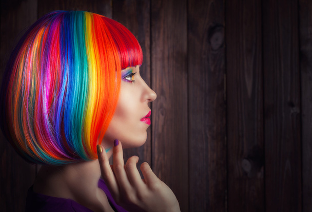 Woman wearing colorful wig - Фото, изображение
