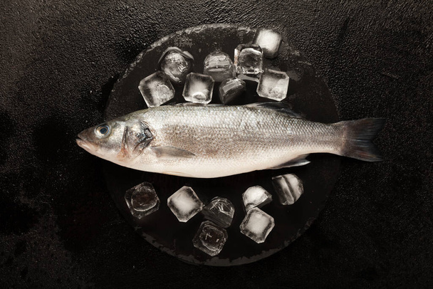 Fresh labrax on ice, raw sea fish. Protein and omega 3. - Foto, afbeelding