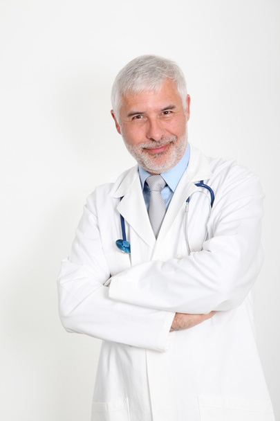 Senior doctor with arms crossed - Фото, зображення