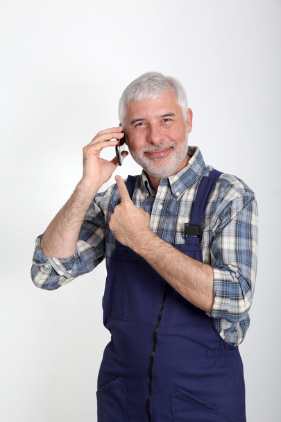 Portrait of artisan with mobile phone - Фото, изображение
