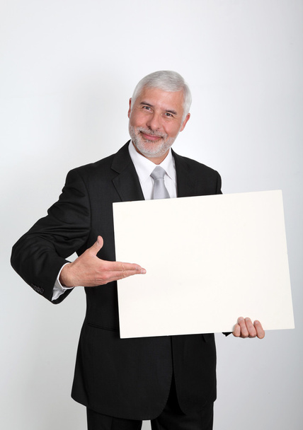 Businessman holding message board - Фото, зображення
