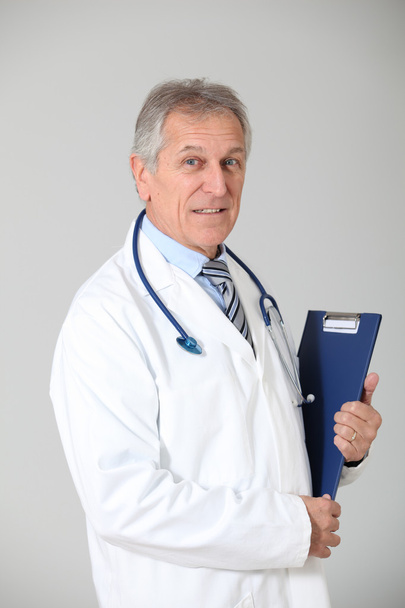 Senior doctor standing on white background - Foto, Imagem