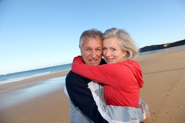 Senior couple exercising by the sea - Foto, imagen