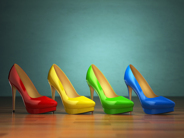 Choice of high heels shoes in different colors on vintage green  - 写真・画像