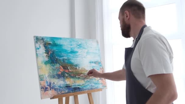 Super slow motion 240 fps, the artist paints an abstract picture in the studio. - Video