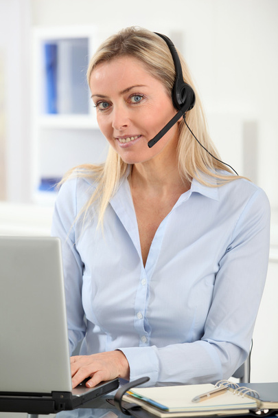 Closeup on blond woman with headset on - Фото, изображение