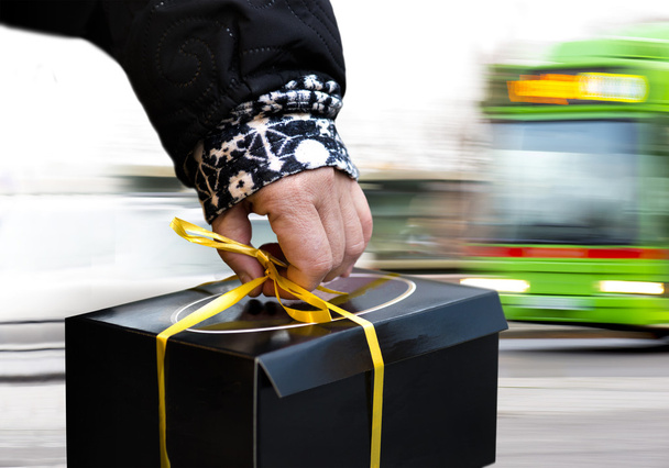 Hand of person carrying black box - Photo, Image