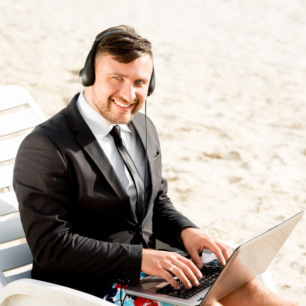 Businessman on the beach - Photo, Image