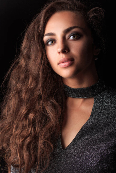 beautiful young woman with long hair and dark curly hairstyle. studio shot. - Valokuva, kuva