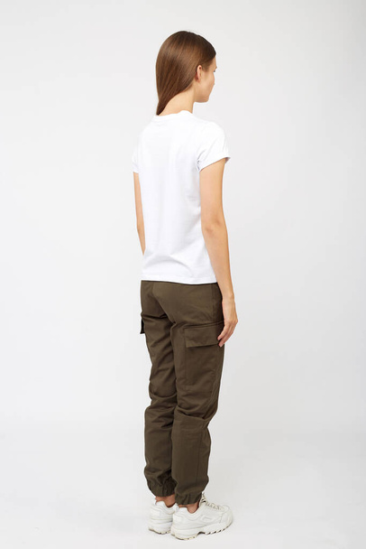 girl in beige cargo pants and white t-shirt - Photo, Image