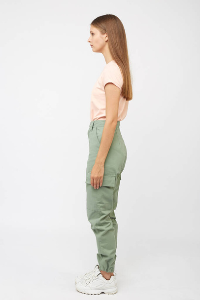 girl in beige cargo pants and t-shirt - Photo, Image