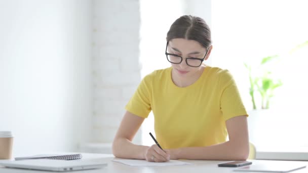 Woman Writing on Paper in Office - Footage, Video