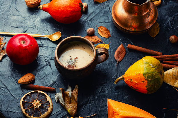 Pumpkin latte or coffee on an autumn background - Photo, Image