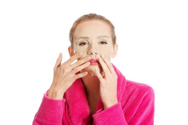 Women getting facial mask - Photo, Image